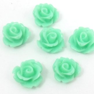 10 פרחים מפלסטיק להדבקה , 10ממ, טורכיז בהיר
