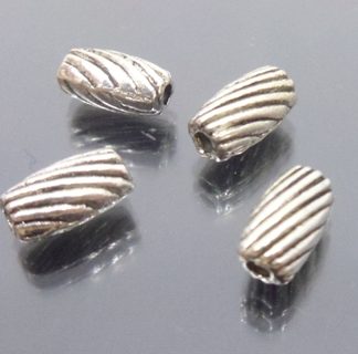 50 יח' חרוזי מתכת ניקל ספירלה 7X4ממ